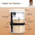 Sourdough starter jar included in the Essential Sourdough Bread Making Kit, featuring measurement markings and care instructions.