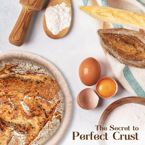 Artfully arranged ingredients around a freshly baked loaf in ABIOTO's sourdough bread proofing baskets.